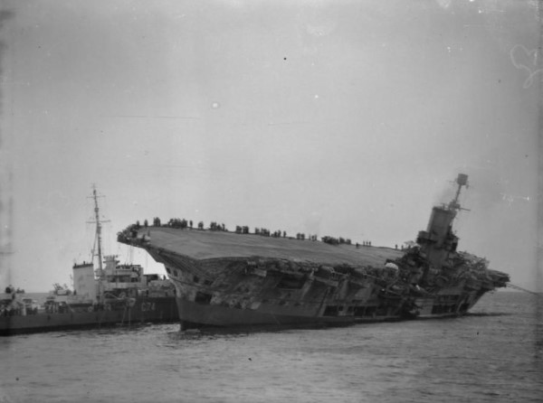 HMS Legion alongside the listing HMS Ark Royal